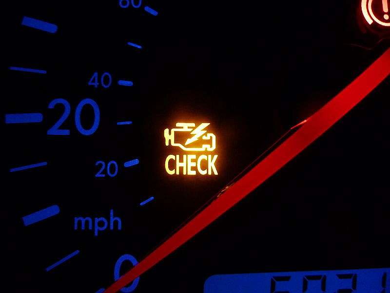 Photo of a vehicle's Check Engine Light.