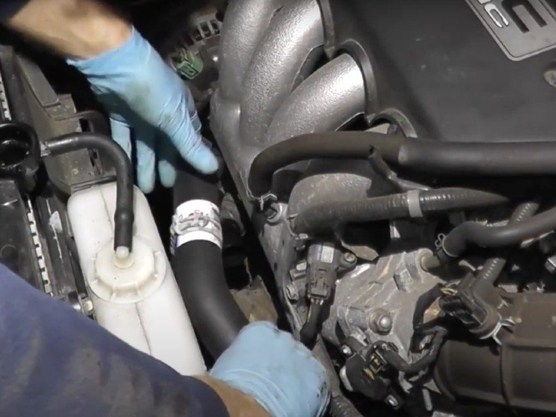 Photo of leaking radiator hose being replaced by mechanic in Long Beach.