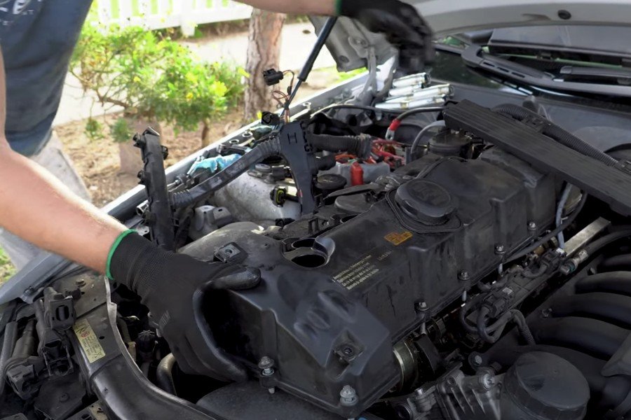 Mechanic making engine repairs in Long Beach, CA.